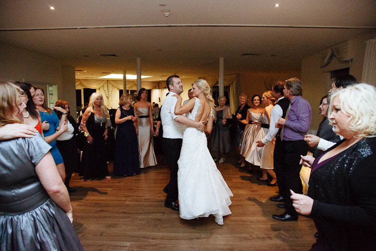 Aggie and Alex dance in a circle of wedding guests at Lindenderry.