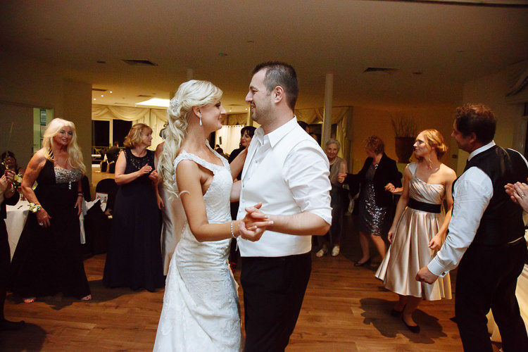 Aggie and Alex dance face-to-face among wedding guests at Lancemore Lindenderry Red Hill.