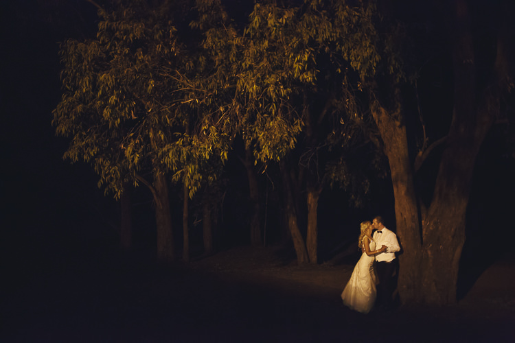 Aggie and Alex have night photo taken under trees at Lancemore Lindenderry Red Hill.
