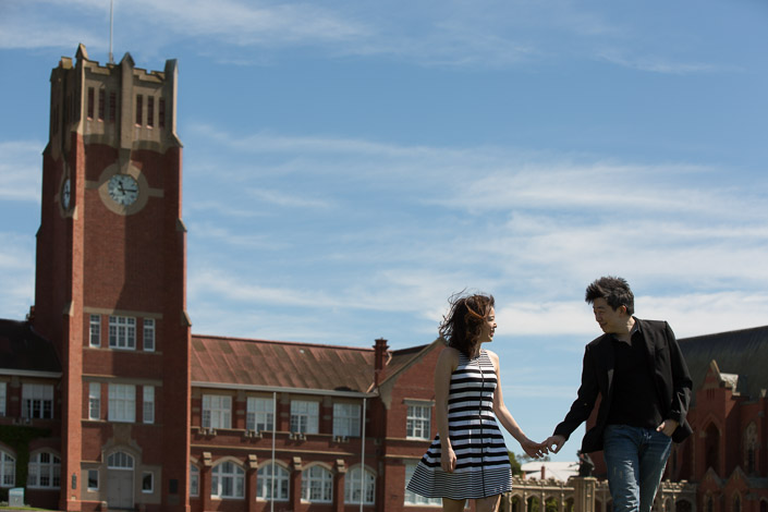 The couple hold hands beneath the clock tower at Geelong Grammar School in Corio.