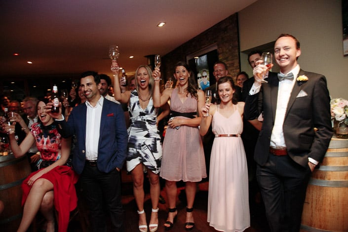Every glass and stubby lifts to the newlyweds at once