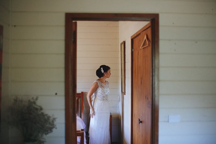 The bride waits in a white weatherboard room at Pennyroyal Retreat