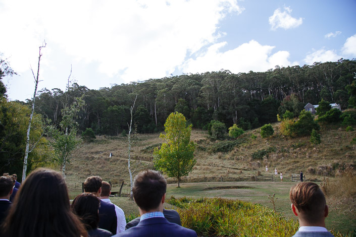 Guests watch the distant hillside processional at Pennyroyal Otways Retreat