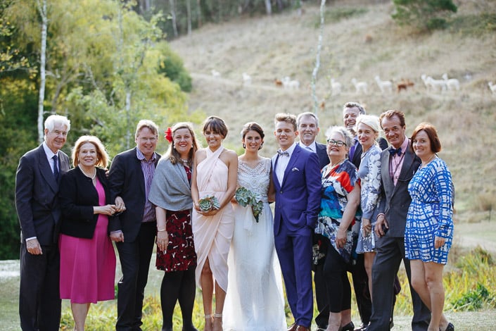 The couple join guests for a group portrait with alpacas on the Pennyroyal Otways Retreat hillside