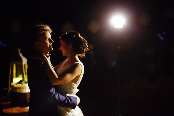 The couple turn together beneath lanterns at Pennyroyal Otways Retreat
