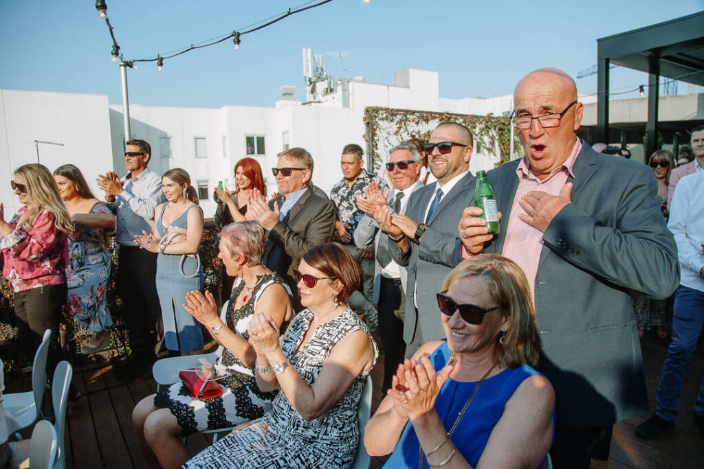 Guests applaud beneath the festoon lights at The Prince Deck.