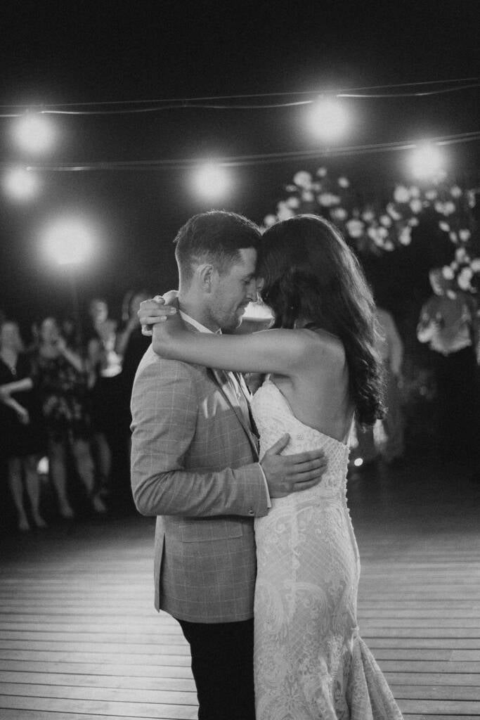 Black-and-white close-up of Georgia and Michael touching foreheads during their dance.