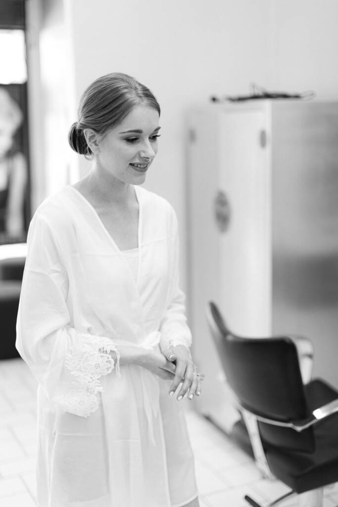 Sue smiles beside a styling chair during preparations at her parents' Mount Waverley home.