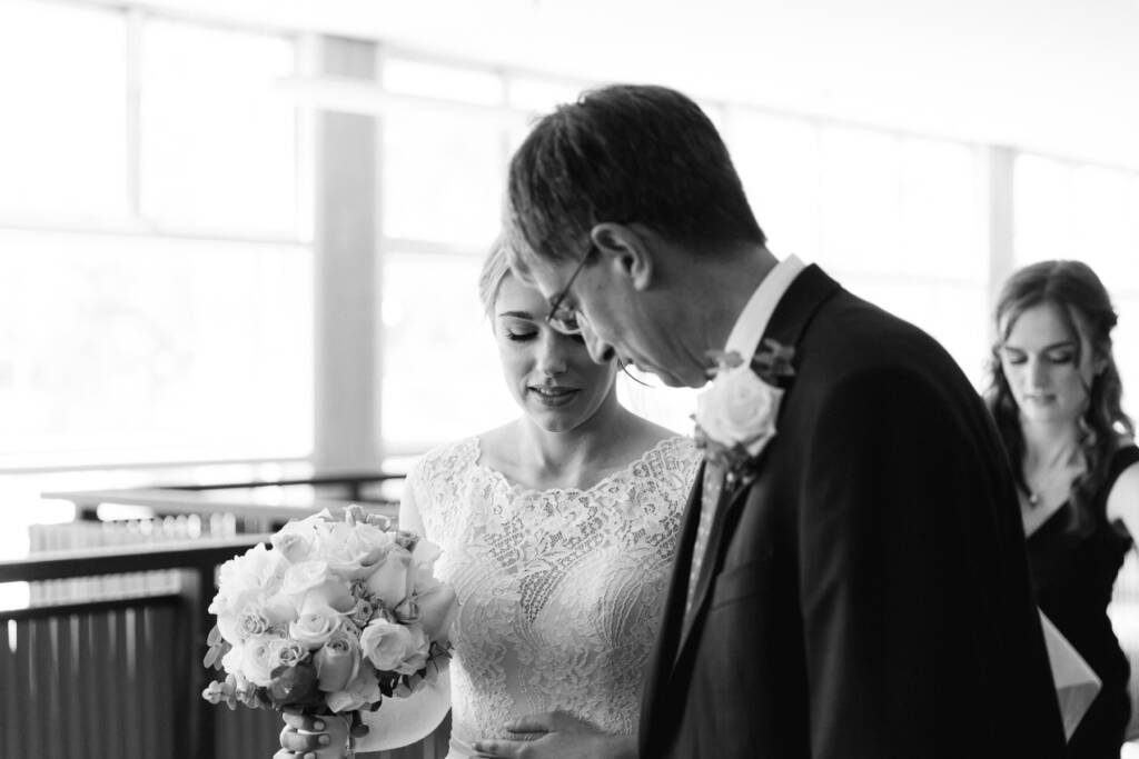 Sue smiles beside her escort in the foyer of Syndal Baptist Church.