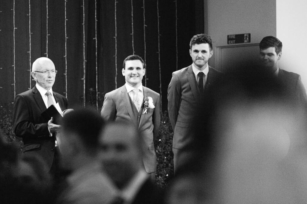 Chris waits beside the officiant and attendants at Syndal Baptist Church.