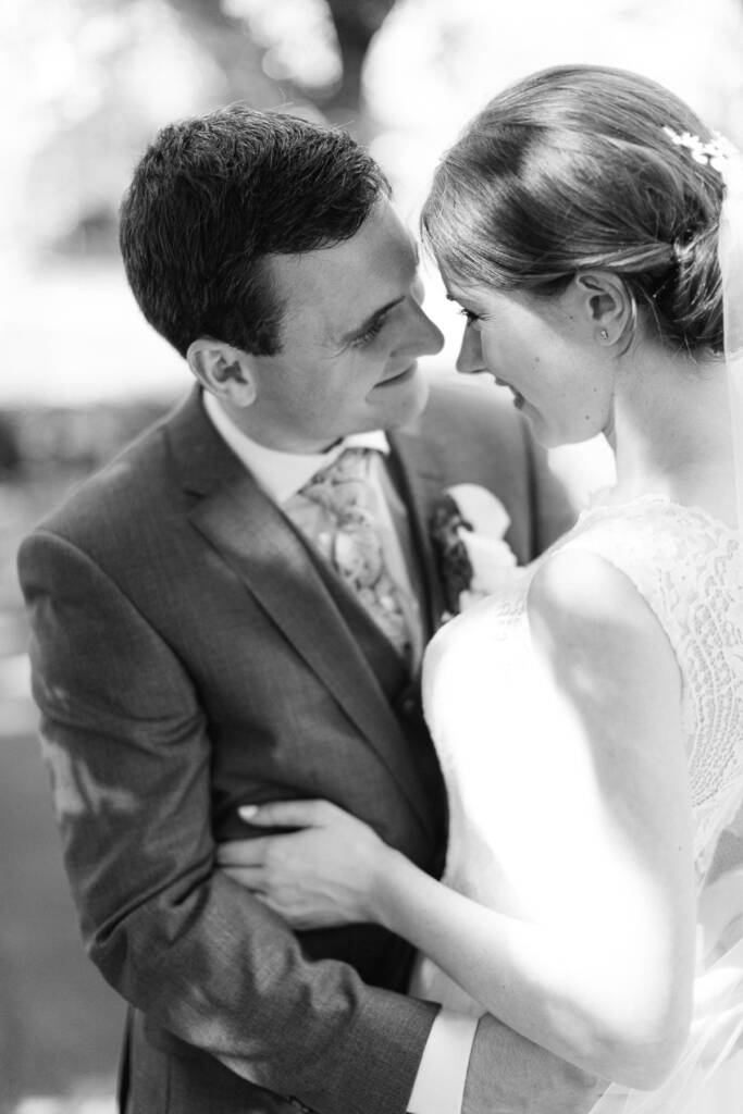 Sue and Chris face each other with their foreheads close during portraits at Canterbury Gardens.