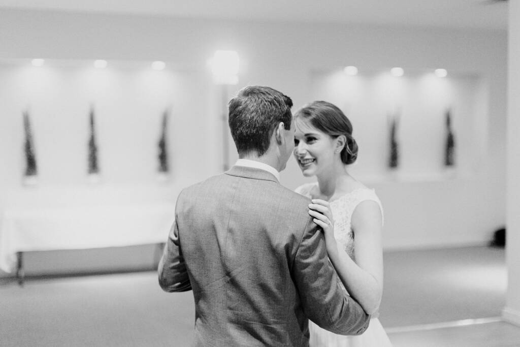 Sue and Chris dance facing each other in the Riversdale reception room.