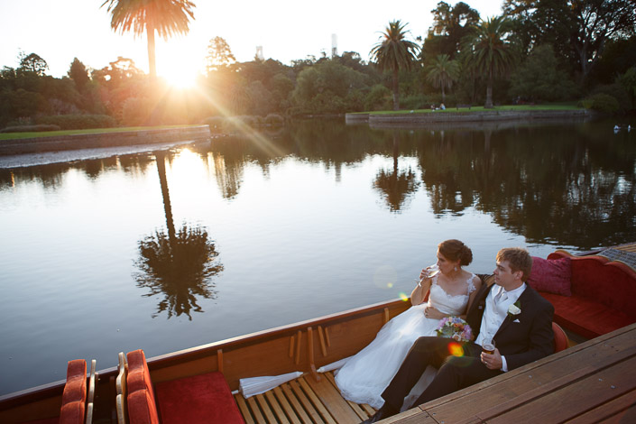 Frances sips champagne beside Tim in a punt at sunset on the Ornamental Lake, Royal Botanic Gardens.