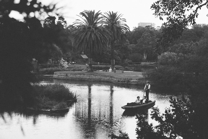 Black and white photo of a punter poling the couple across the Ornamental Lake, Royal Botanic Gardens.