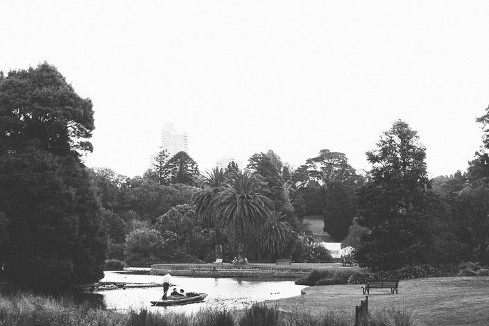 Wide black and white view of the punt crossing the Ornamental Lake at Royal Botanic Gardens Melbourne.