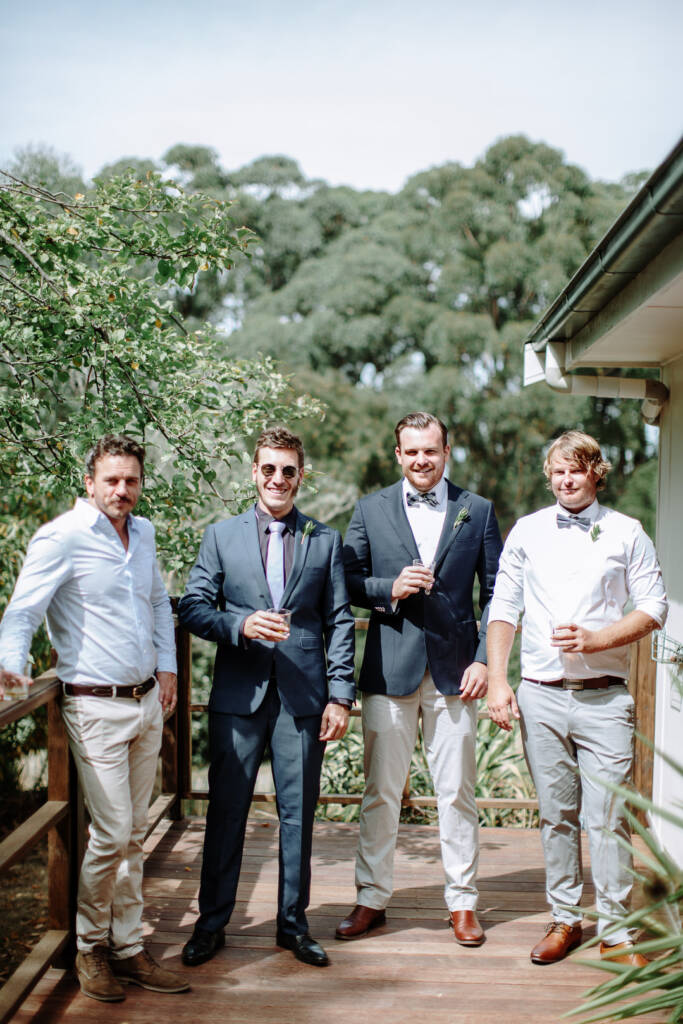 Jye poses with three companions on the timber verandah at Strathvea Guesthouse.