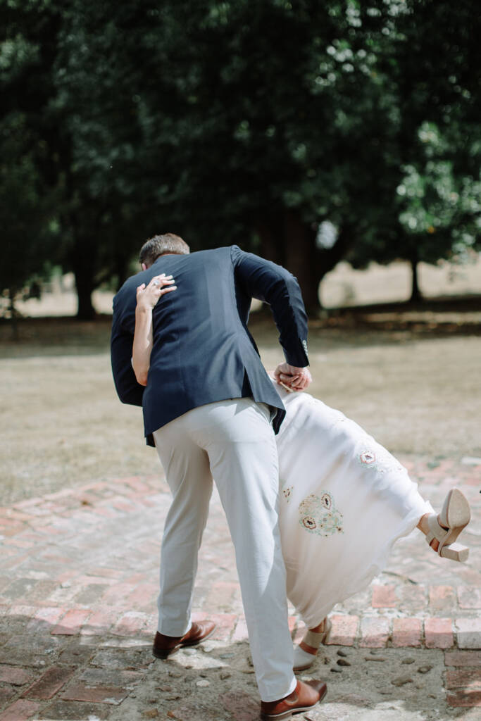 Jye dips Sarah back in his arms during the ceremony at Strathvea Guesthouse.
