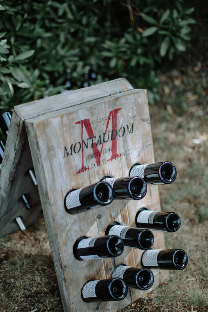 Wine bottles sit in a timber rack at the Strathvea Guesthouse reception.