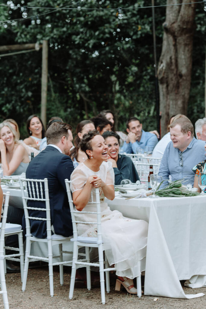 Sarah laughs during the reception speeches.