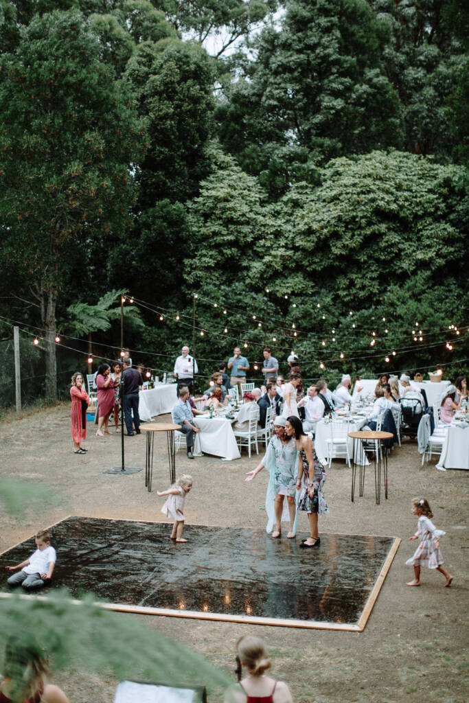 Children and adults gather on the outdoor dance floor at Strathvea Guesthouse.