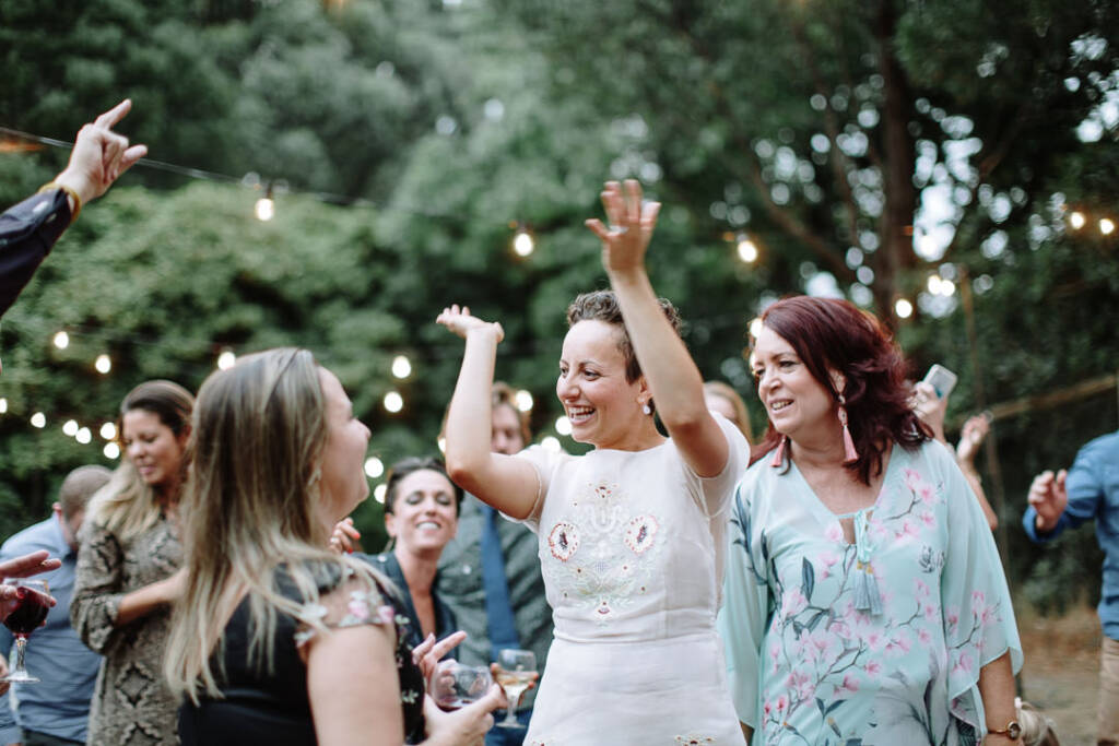 Sarah dances with guests on the outdoor dance floor at Strathvea Guesthouse.