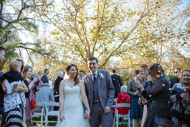 Petals fly as Shannon and Luke walk back up the aisle hand in hand, both beaming.