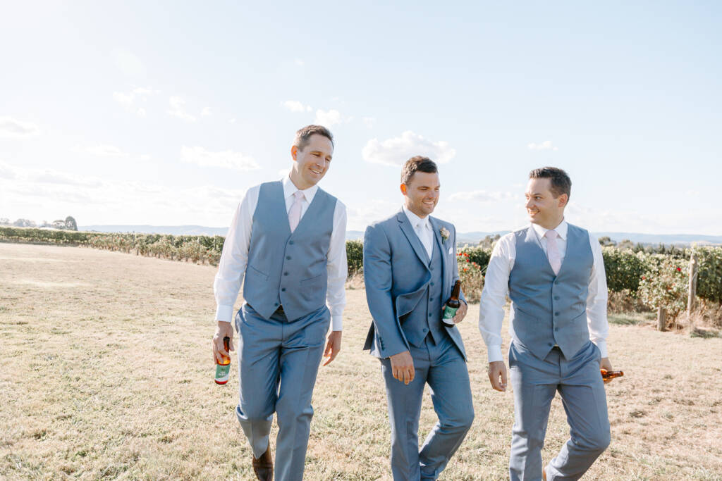 Waistcoats and pale pink ties, beers in hand between takes