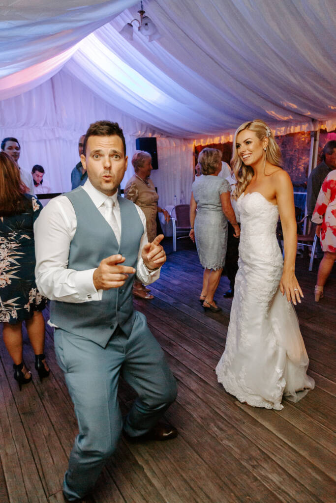 Finger guns and a lunge, the groom brings his best moves