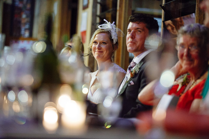 The couple soften at the head table as the tributes flow