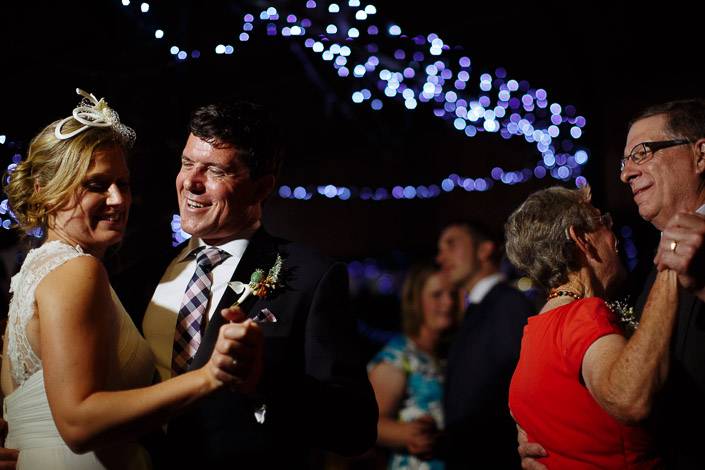 An older couple dances beside Lindsey and Dennis on the twinkling floor.