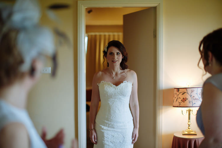 Heidi reveals her strapless lace gown in a cottage doorway at Yester Grange