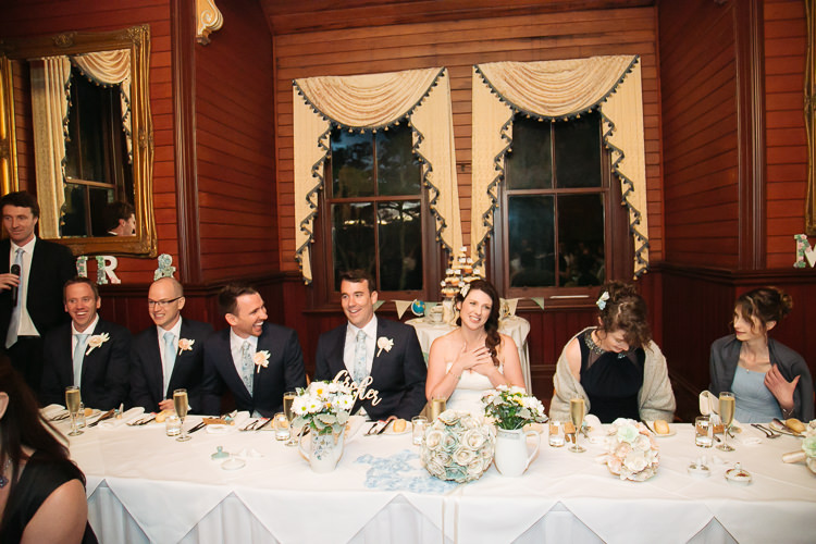 Heidi, Russell and their attendants laugh at the bridal table inside Yester Grange Estate