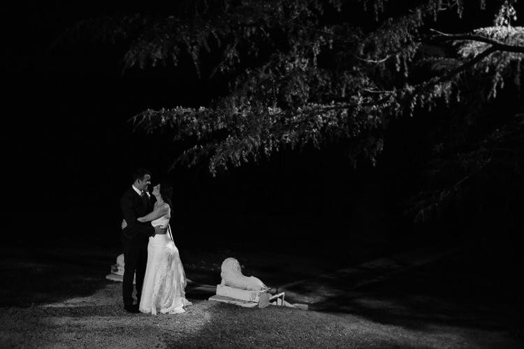 Black-and-white night photo of Heidi and Russell beneath trees at Yester Grange Estate in the Blue Mountains