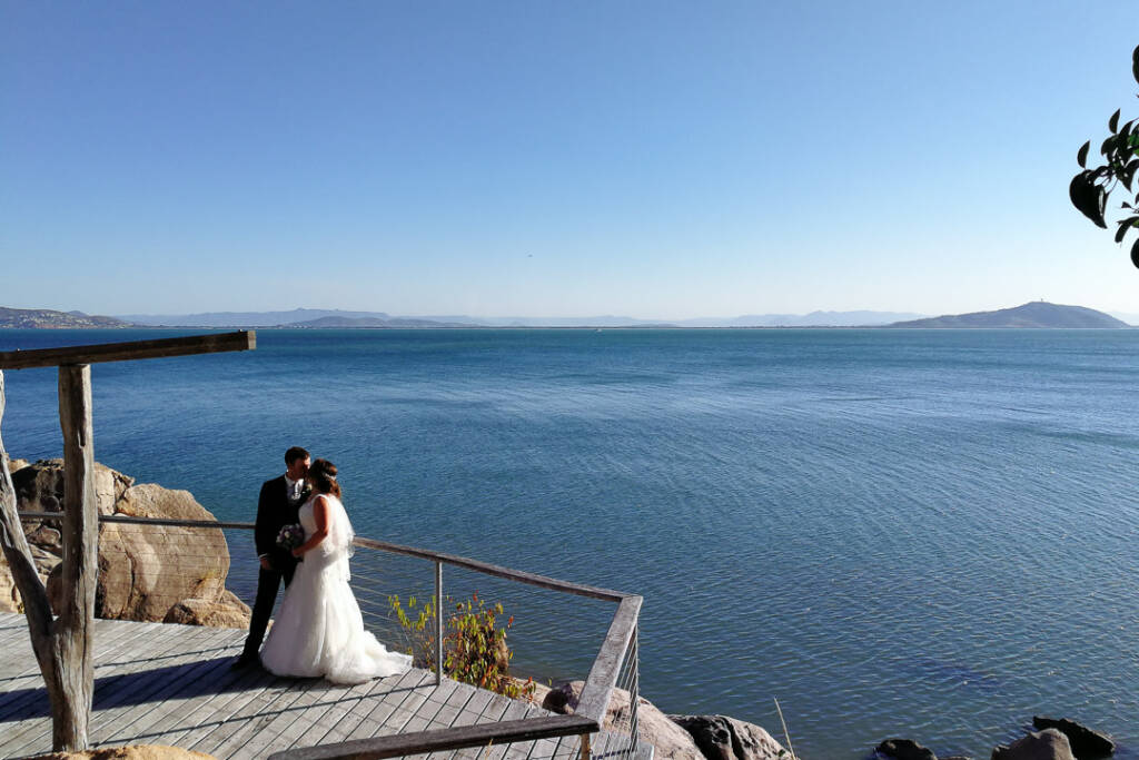 Natalie and Ben on the headland deck above the wide blue of the Coral Sea, Magnetic Island