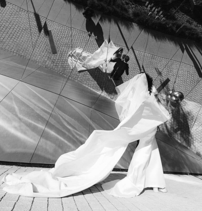 The bride&rsquo;s train sweeping across the plaza, the couple&rsquo;s shadow on the wall &mdash; National Museum of Australia, Canberra