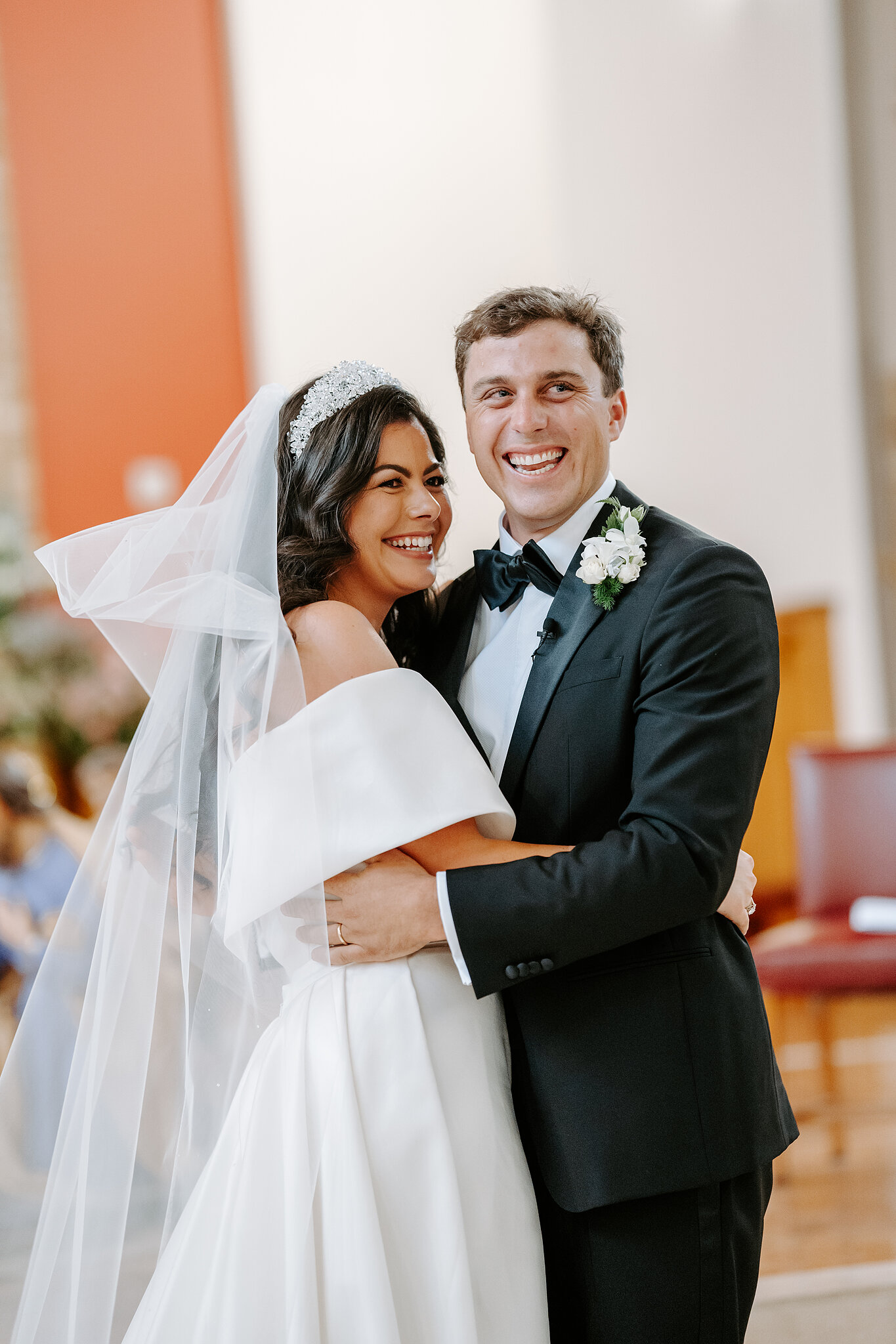 Helena and Xavier smile together at the front of St Christopher’s Cathedral.