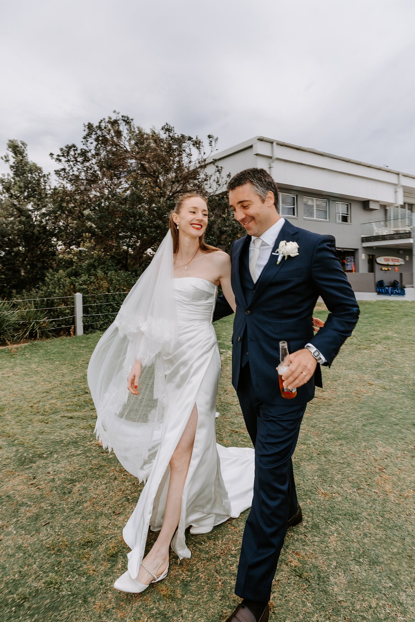 Michele and Nico laugh their way across the lawn outside Horizons South Maroubra.