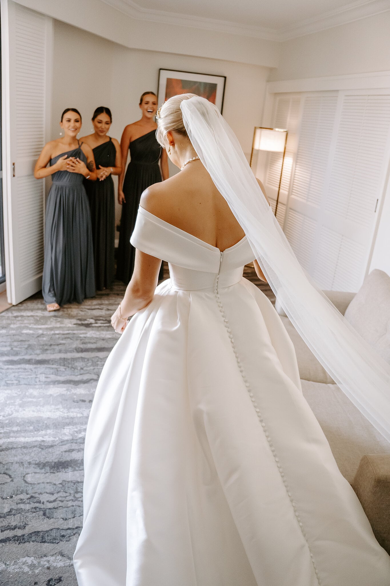 The reveal: Ashley’s bridesmaids see her in her gown and long veil for the first time.