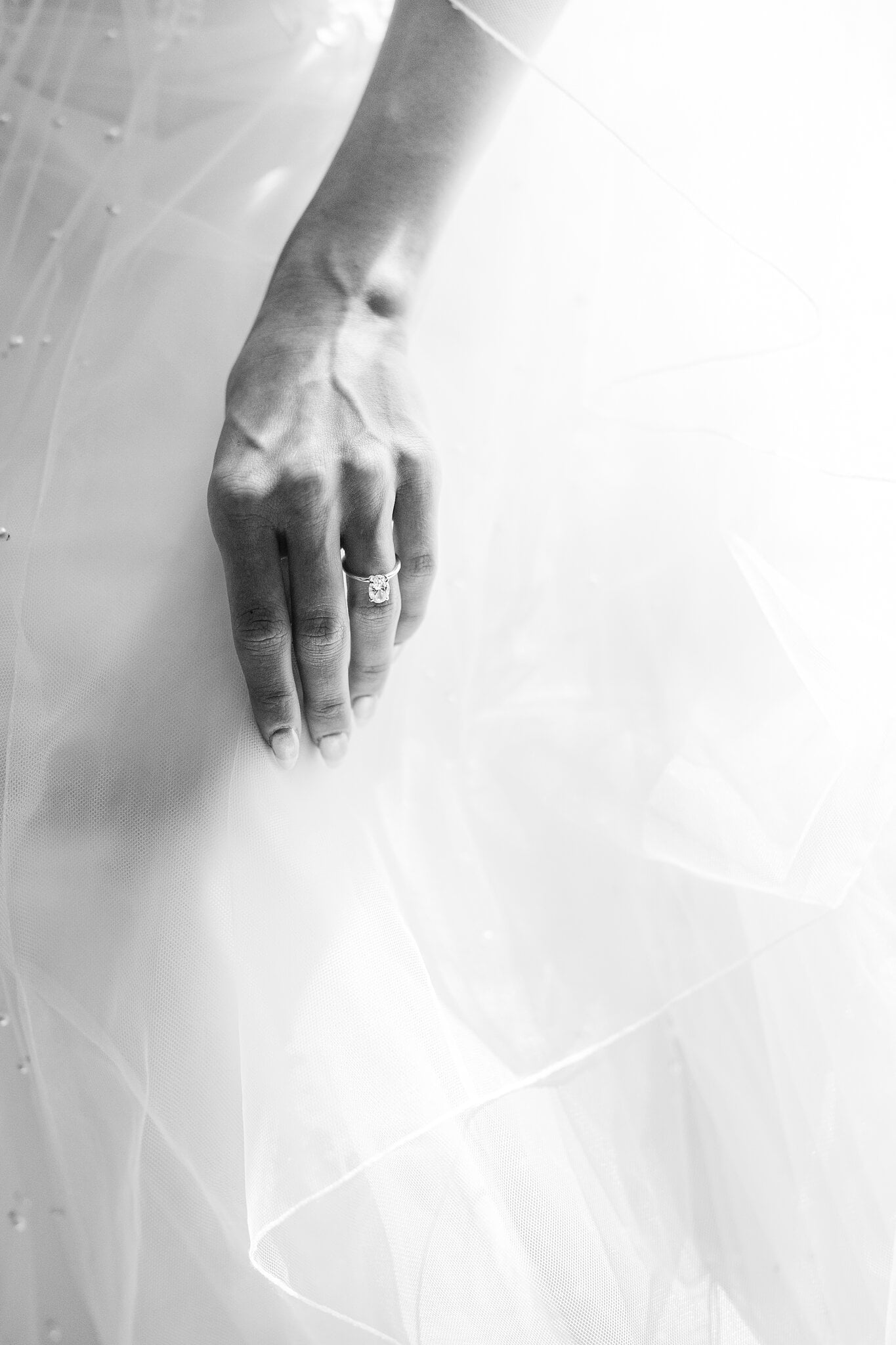 Alexa’s engagement ring resting on layers of soft tulle.
