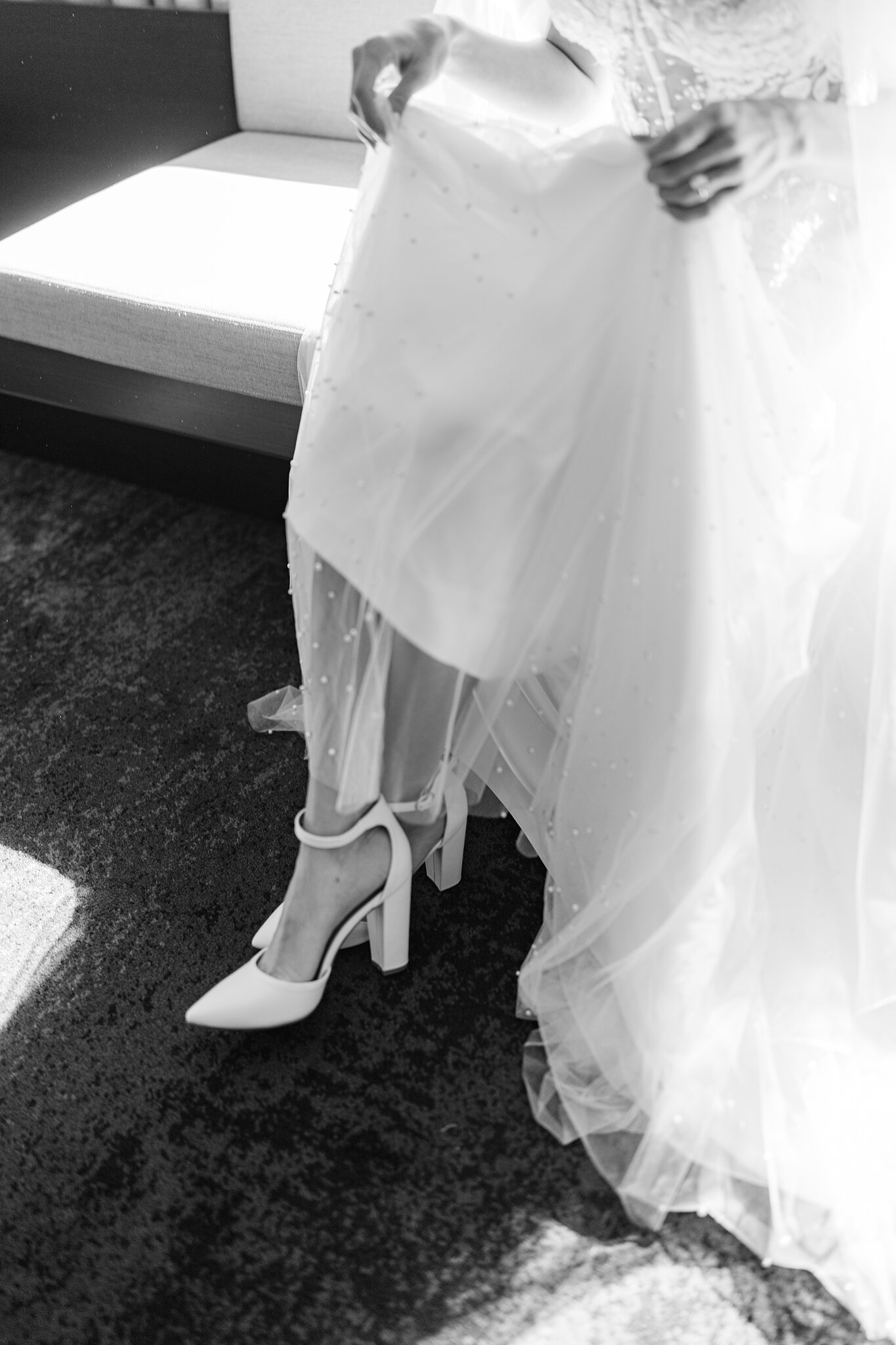Block-heel bridal shoes peek out as Alexa lifts her pearl-dotted tulle skirt.
