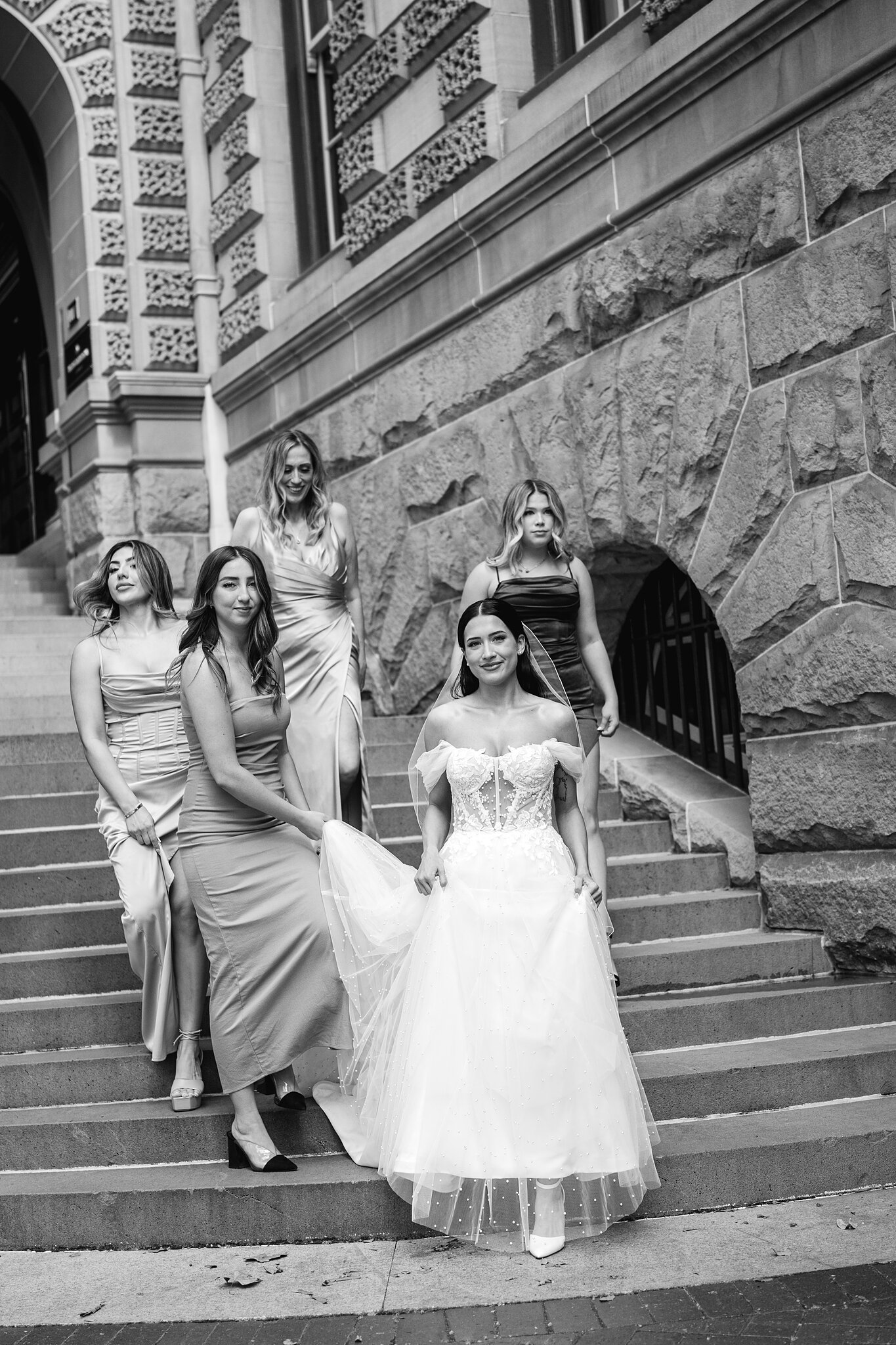 Alexa and her bridesmaids on the sandstone steps outside InterContinental Sydney.
