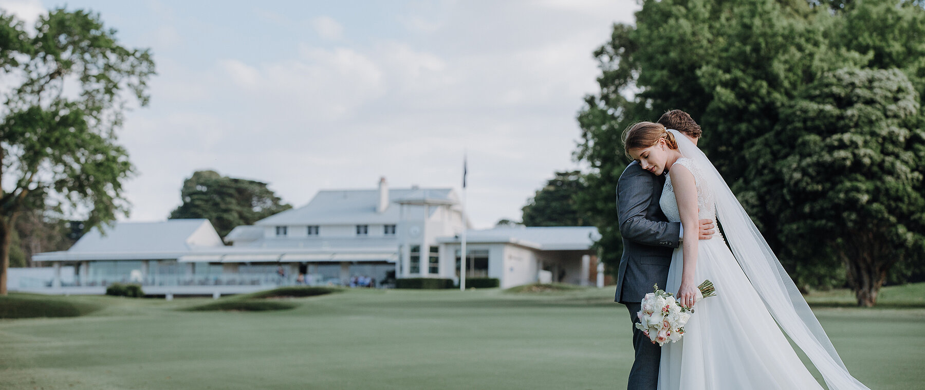 Sue and Chris embrace on the lawn at Riversdale Golf Club Riversdale Golf Club Wedding Photo Melbourne