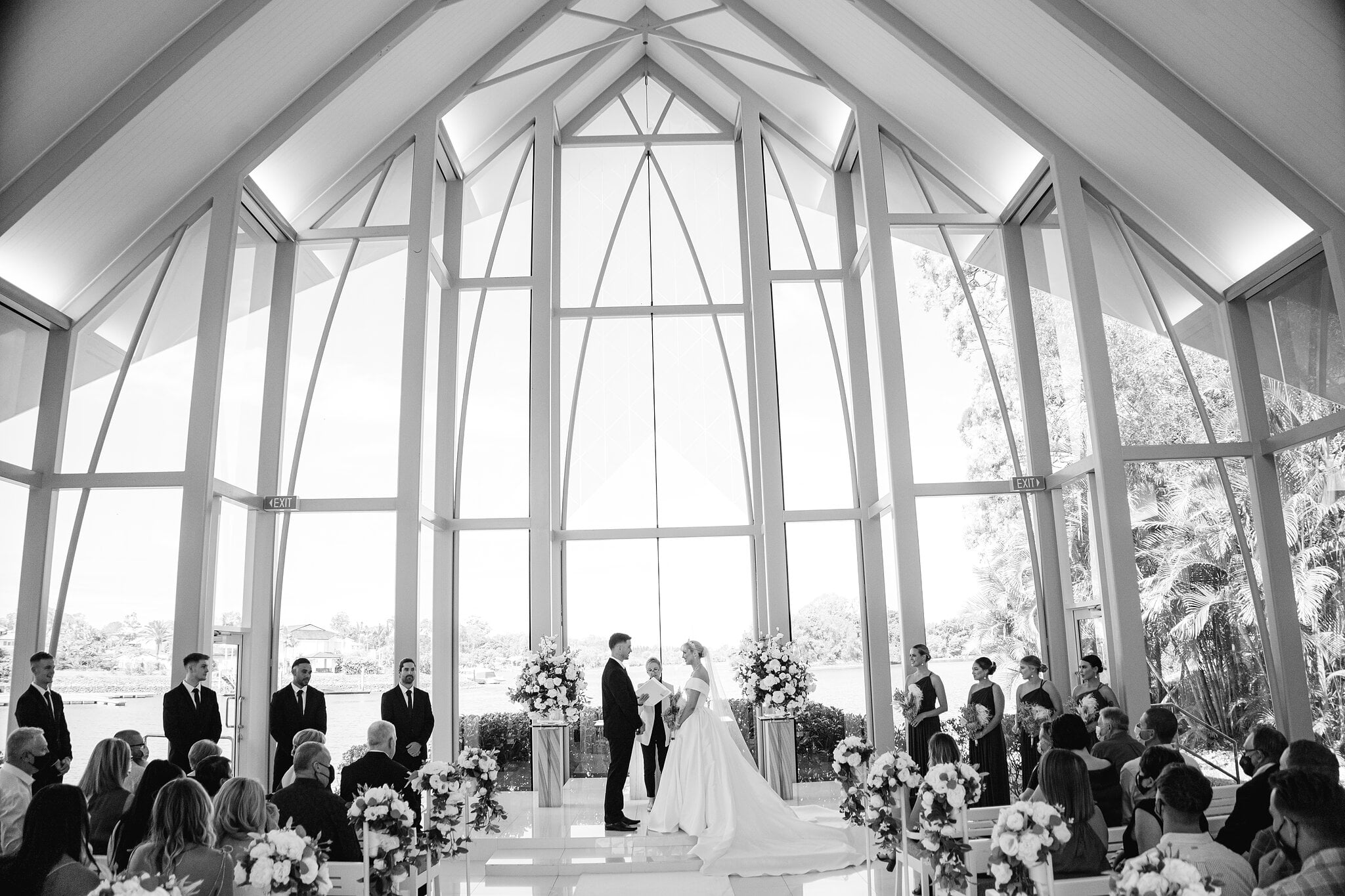 The whole chapel in black and white, its glass walls framing Ashley and Lane’s ceremony.