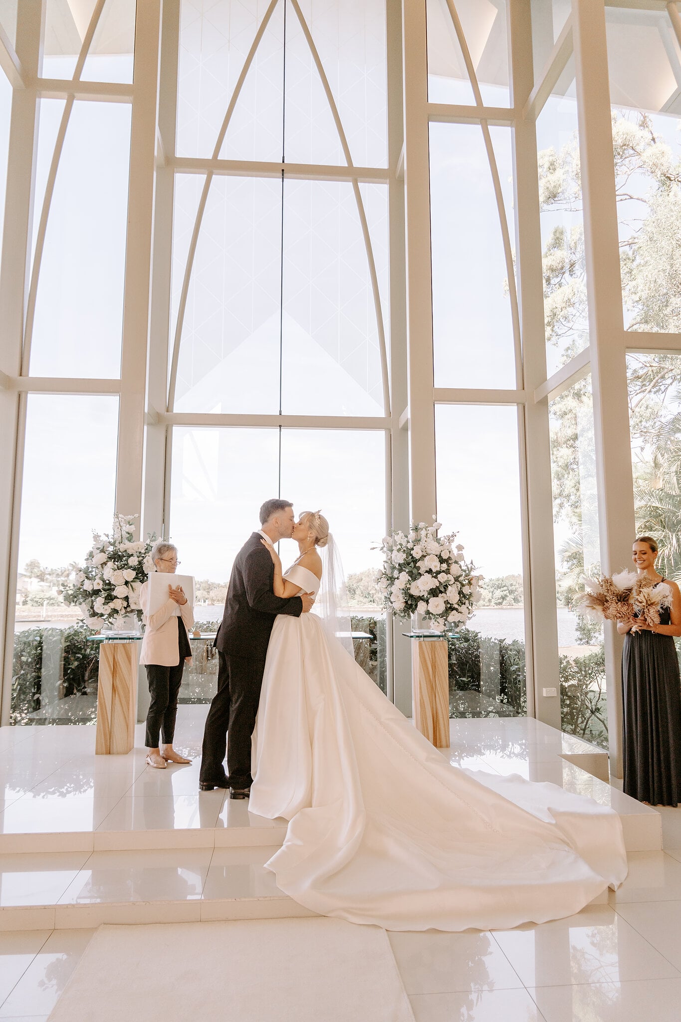The first kiss beneath the glass arches of the chapel at InterContinental Sanctuary Cove.