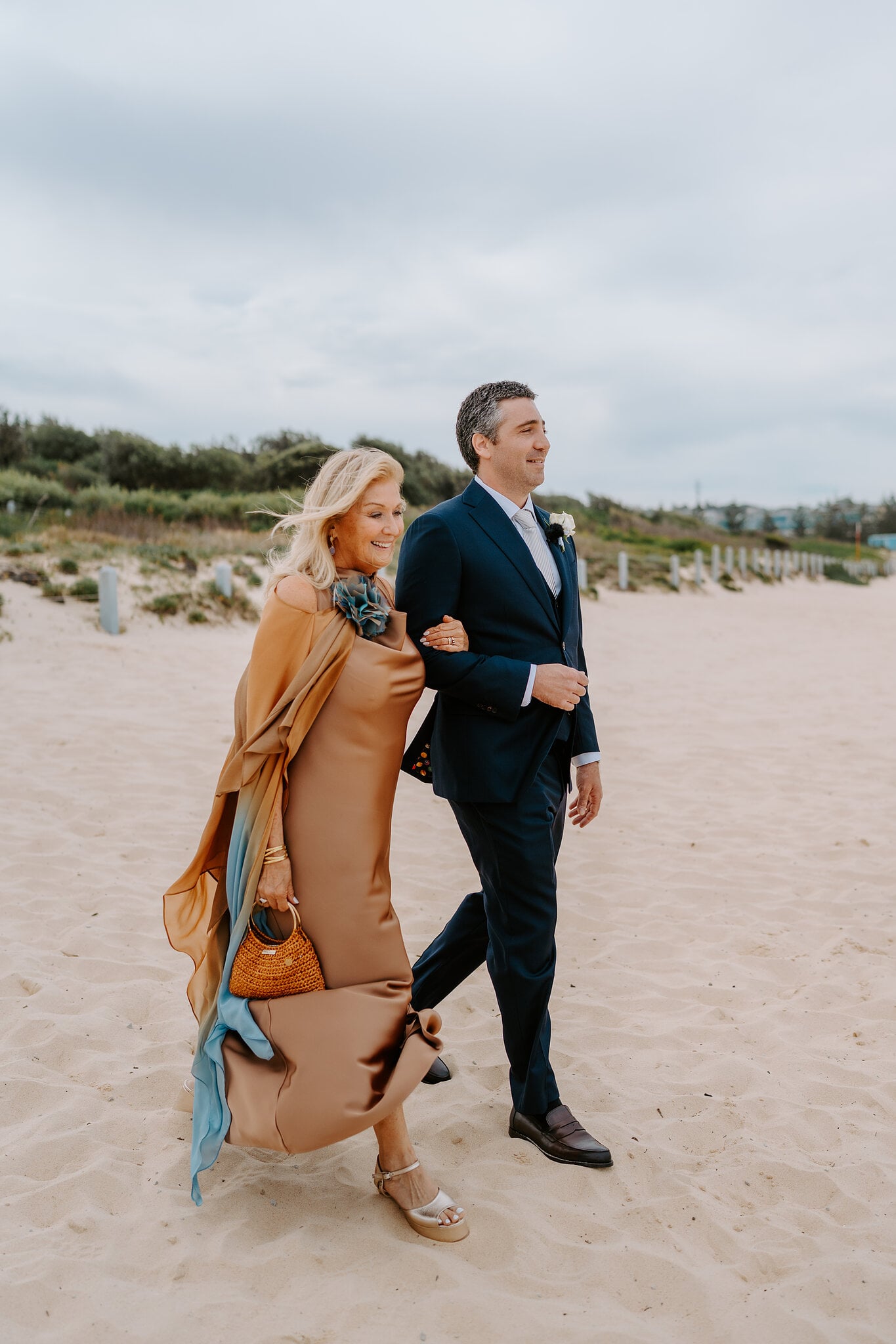 Nico walks his mum along the sand at South Maroubra Beach before the ceremony.