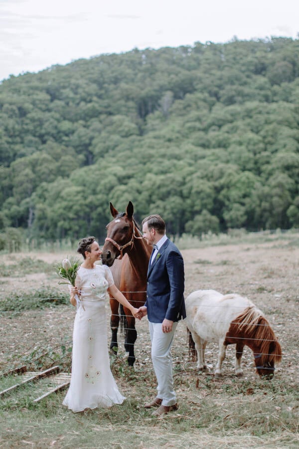 Sarah and Jye with a horse and pony at Strathvea Guesthouse Strathvea Guesthouse Wedding Photo Yarra Valley