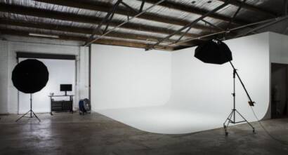 The white cyclorama, softboxes and brick walls inside Luminosity Studio, home of the Veri team