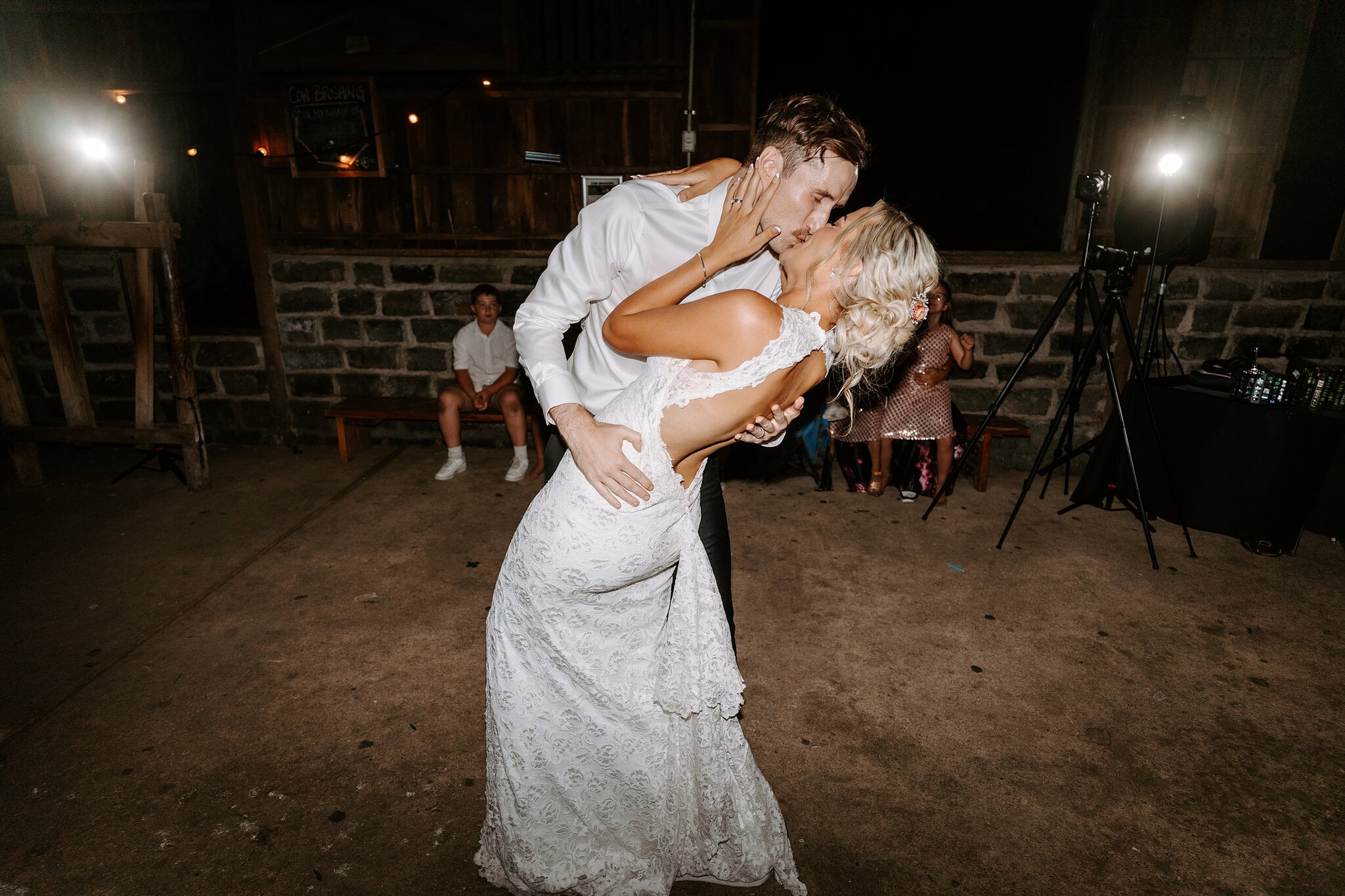 George dips Emma for a kiss during their first dance on the barn floor.
