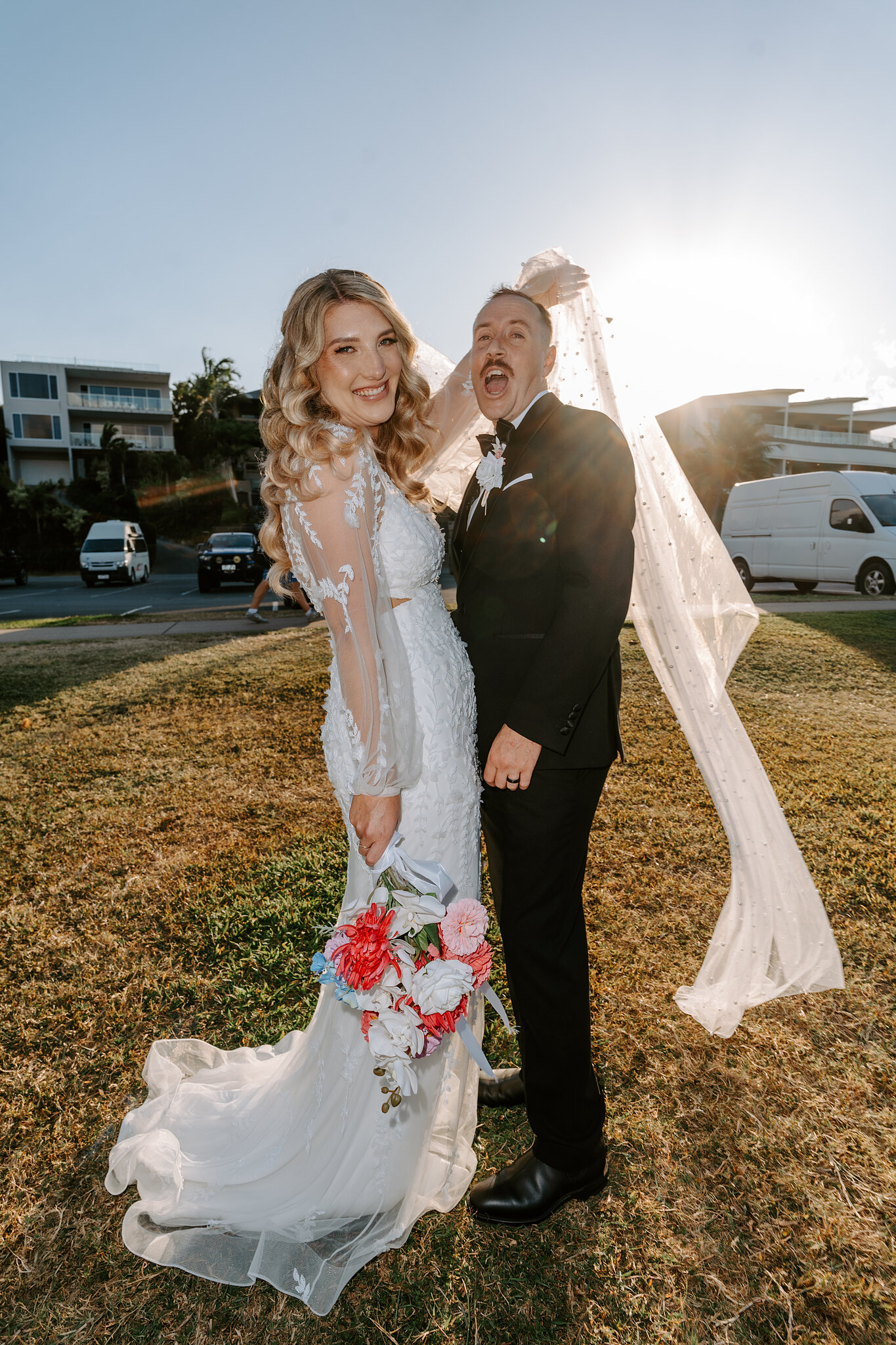 Brendan laughs as Anna’s veil lifts in the wind.