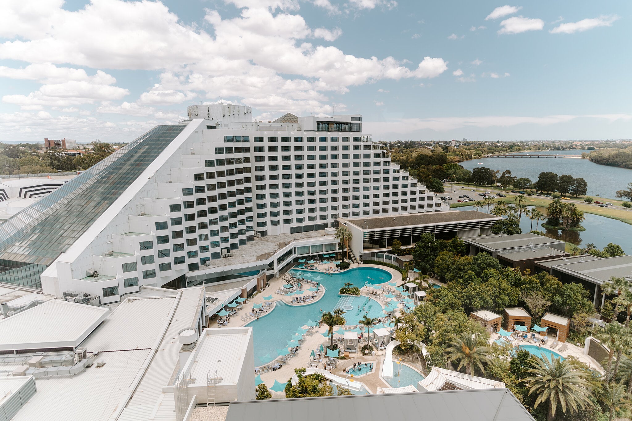 Crown Perth’s pools, palms and the Swan River seen from Claire’s room high in Crown Towers.